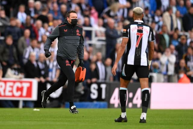 Club doctor Paul Catterson runs to assist an elderly man who had suffered a cardiac arrest at St James's Park.