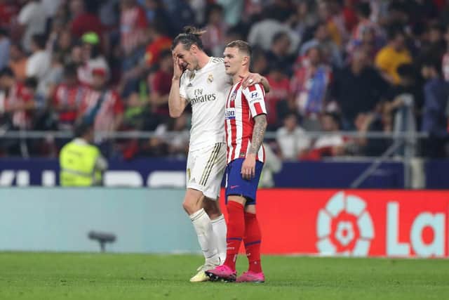 Kieran Trippier of Atletico Madrid speaks to Gareth Bale of Real Madrid after the Liga match between Club Atletico de Madrid and Real Madrid CF at Wanda Metropolitano on September 28, 2019 in Madrid, Spain. (Photo by Angel Martinez/Getty Images)