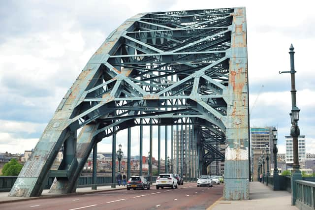 The iconic Tyne Bridge on the River Tyne between Newcastle and Gateshead which is in an alarming state, covered in rust patches and grafitti.