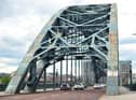 The iconic Tyne Bridge on the River Tyne between Newcastle and Gateshead which is in an alarming state, covered in rust patches and grafitti.
