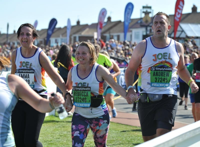 Crossing the finishing line together in 2019.
