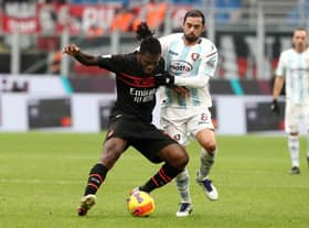 MILAN, ITALY - DECEMBER 04: Franck Kessie of AC Milan battles for possession with Andrea Schiavone of Salernitana  during the Serie A match between AC Milan v US Salernitana at Stadio Giuseppe Meazza on December 04, 2021 in Milan, Italy. (Photo by Marco Luzzani/Getty Images)