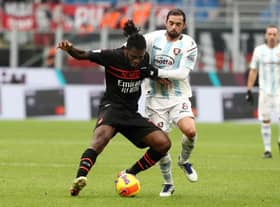MILAN, ITALY - DECEMBER 04: Franck Kessie of AC Milan battles for possession with Andrea Schiavone of Salernitana  during the Serie A match between AC Milan v US Salernitana at Stadio Giuseppe Meazza on December 04, 2021 in Milan, Italy. (Photo by Marco Luzzani/Getty Images)