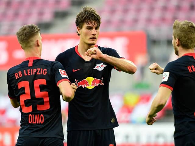 COLOGNE, GERMANY - JUNE 01: Patrik Schick of Leipzig celebrates with team mates after scoring his sides first goal during the Bundesliga match between 1. FC Koeln and RB Leipzig at RheinEnergieStadion on June 1, 2020 in Cologne, Germany. (Photo by Ina Fassbender/Pool via Getty Images)
