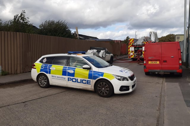 The area around the garage was blocked off by police as people were told to "avoid the area".