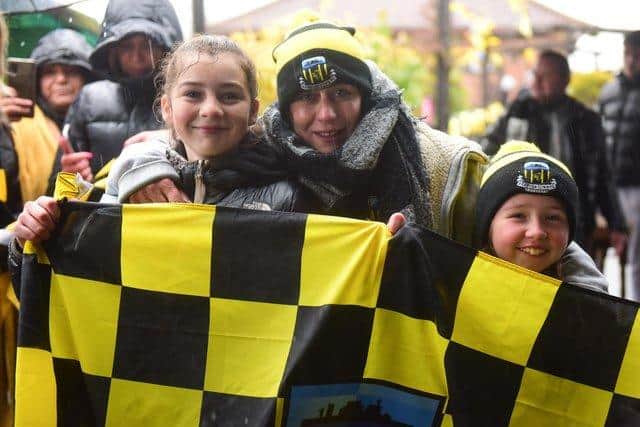 Nina Harkness and daughters Lily, 13 and Evie, nine celebrating Hebburn's FA Vase victory. See question 8.
