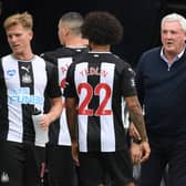 Newcastle United's English head coach Steve Bruce (R) speaks with his players during a drinks break in the English Premier League football match between Newcastle United and Tottenham Hotspur at St James' Park in Newcastle-upon-Tyne, north-east England on July 15, 2020.