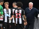 Newcastle United's English head coach Steve Bruce (R) speaks with his players during a drinks break in the English Premier League football match between Newcastle United and Tottenham Hotspur at St James' Park in Newcastle-upon-Tyne, north-east England on July 15, 2020.