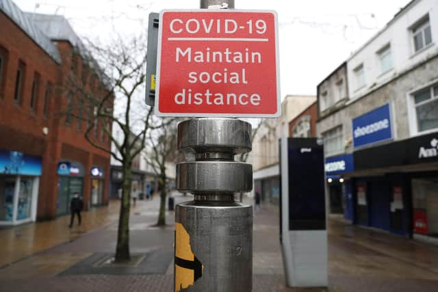 A Covid-19 social distancing sign  during England's third national lockdown to curb the spread of coronavirus.