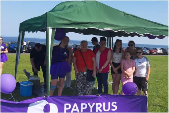 Kayleigh Llewellyn with the family of her heart donor Sinead Bree at the end of her charity walk in her memory.