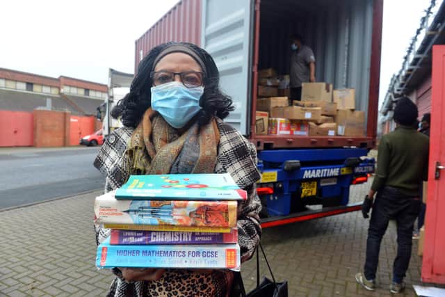 Book Aid For Africa founder Elewechi Okike preparing for the books to head out to Nigeria.