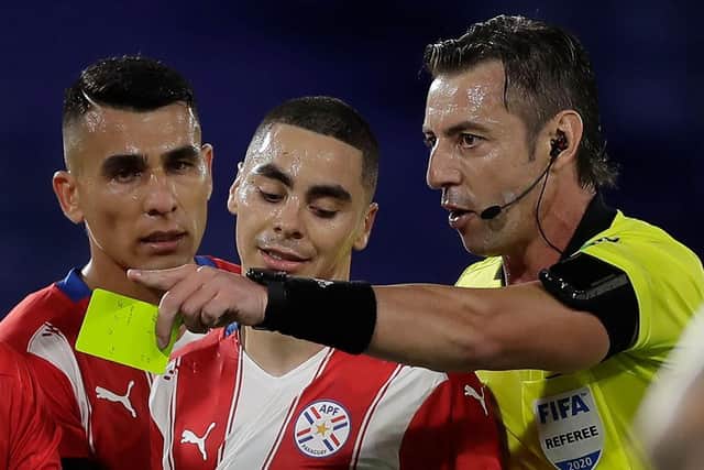 Miguel Almiron is shown a yellow card playing for Paraguay.