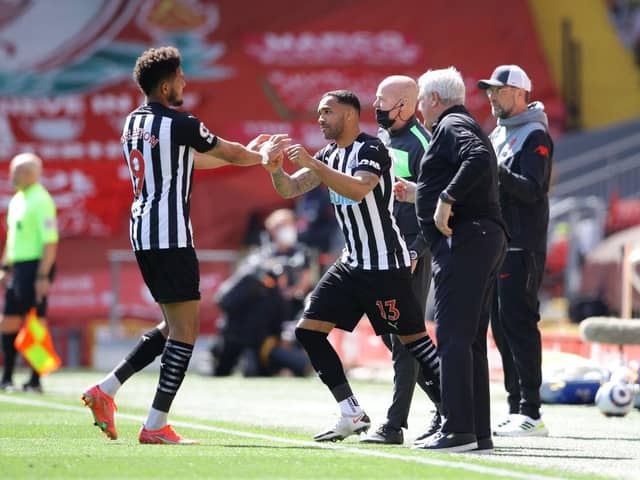 Callum Wilson of Newcastle United comes on for Joelinton of Newcastle United during the Premier League match between Liverpool and Newcastle United at Anfield on April 24, 2021 in Liverpool, England.