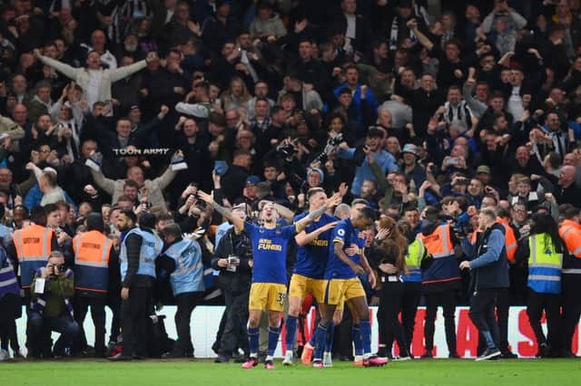 Bruno Guimaraes of Newcastle United celebrates after Alexander Isak of Newcastle United scores the team's second goal during the Premier League match between Nottingham Forest and Newcastle United at City Ground on March 17, 2023 in Nottingham, England. (Photo by Shaun Botterill/Getty Images)