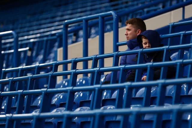 Fans and spectators sit in the rail seating section, installed for a trial of safe-standing at Chelsea's Stamford Bridge.