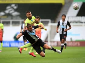 NEWCASTLE UPON TYNE, ENGLAND - JUNE 28: Nicolas Otamendi of Manchester City battles for possession with Andy Carroll of Newcastle United  during the FA Cup Quarter Final match between Newcastle United and Manchester City at St. James Park on June 28, 2020 in Newcastle upon Tyne, England. (Photo by Owen Humphreys/Pool via Getty Images)