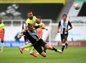 NEWCASTLE UPON TYNE, ENGLAND - JUNE 28: Nicolas Otamendi of Manchester City battles for possession with Andy Carroll of Newcastle United  during the FA Cup Quarter Final match between Newcastle United and Manchester City at St. James Park on June 28, 2020 in Newcastle upon Tyne, England. (Photo by Owen Humphreys/Pool via Getty Images)