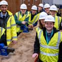 Val Quinan of Tyne Coast College and Adam Johnson, electrical project engineer at Castle Building Services, with some of the electrical students.