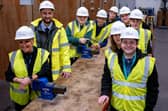Val Quinan of Tyne Coast College and Adam Johnson, electrical project engineer at Castle Building Services, with some of the electrical students.