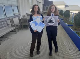 Scalett (left) and Ebony Dembry with some of their original designs.