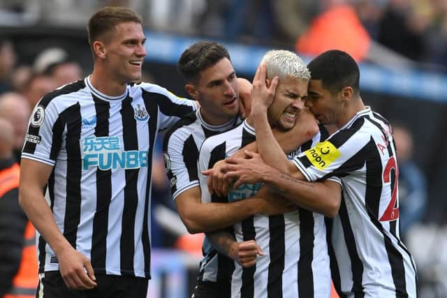 Newcastle player Bruno Guimaraes (2nd r) celebrates his second goal with Sven Botman (l) Fabian Schar and Miguel Almiron (r) during the Premier League match between Newcastle United and Brentford FC at St. James Park on October 08, 2022 in Newcastle upon Tyne, England. (Photo by Stu Forster/Getty Images)