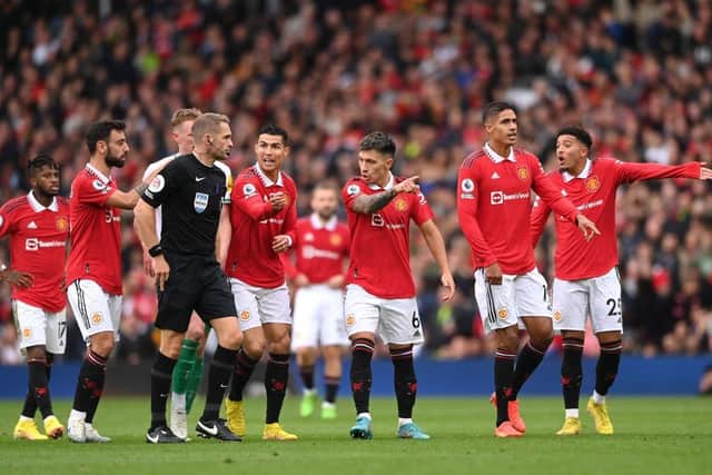 Manchester United players remonstrate with Referee, Craig Pawson following a disallowed goal by Cristiano Ronaldo (4th R) of Manchester United during the Premier League match between Manchester United and Newcastle United at Old Trafford on October 16, 2022 in Manchester, England. (Photo by Stu Forster/Getty Images)