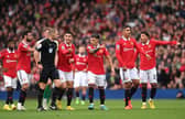 Manchester United players remonstrate with Referee, Craig Pawson following a disallowed goal by Cristiano Ronaldo (4th R) of Manchester United during the Premier League match between Manchester United and Newcastle United at Old Trafford on October 16, 2022 in Manchester, England. (Photo by Stu Forster/Getty Images)
