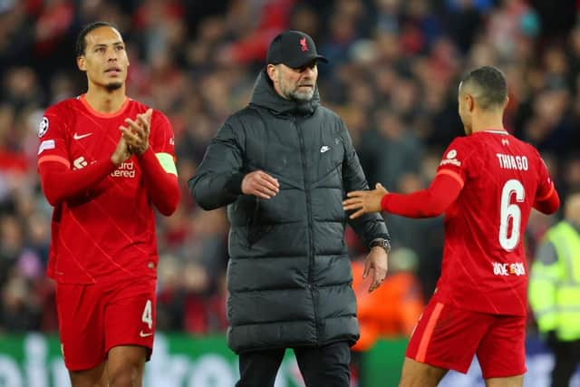 Jurgen Klopp, Manager of Liverpool embraces with Thiago Alcantara of Liverpool during the UEFA Champions League Semi Final Leg One match between Liverpool and Villarreal at Anfield on April 27, 2022 in Liverpool, England. (Photo by Catherine Ivill/Getty Images)