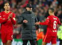 Jurgen Klopp, Manager of Liverpool embraces with Thiago Alcantara of Liverpool during the UEFA Champions League Semi Final Leg One match between Liverpool and Villarreal at Anfield on April 27, 2022 in Liverpool, England. (Photo by Catherine Ivill/Getty Images)