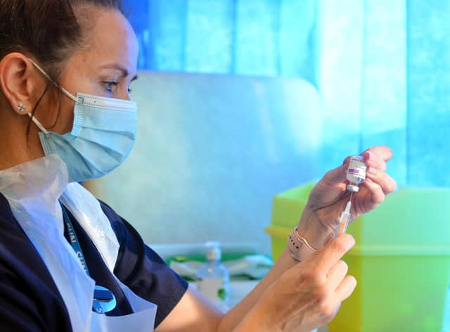 A health worker prepares a covid vaccine. Prime Minister Boris Johnson praised both the vaccination programme and people's efforts during the lockdown as he announced the Government's road map for easing restrictions.