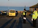 Police officers stop to issue compliance letters to motorists travelling from afar to South Shields seaside, in South Tyneside over the weekend