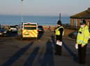 Police officers stop to issue compliance letters to motorists travelling from afar to South Shields seaside, in South Tyneside over the weekend