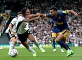 Jacob Murphy of Newcastle United is challenged by Kevin Mbabu of Fulham during the Premier League match between Fulham FC and Newcastle United at Craven Cottage on October 01, 2022 in London, England. (Photo by Henry Browne/Getty Images)