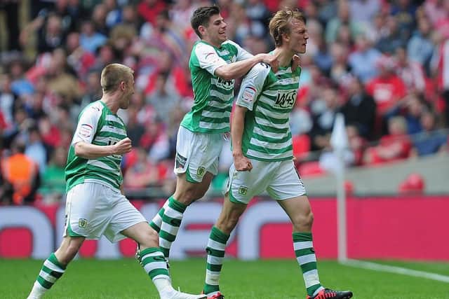 Dan Burn of Yeovil Town celebrates the second goal with team mates during the npower League One play off final between Brentford and Yeovil Town at Wembley Stadium on May 19, 2013 in London, England.  (Photo by Jamie McDonald/Getty Images)