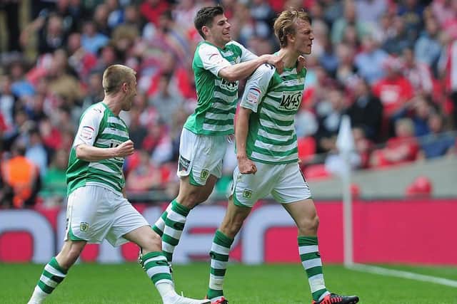 Dan Burn of Yeovil Town celebrates the second goal with team mates during the npower League One play off final between Brentford and Yeovil Town at Wembley Stadium on May 19, 2013 in London, England. (Photo by Jamie McDonald/Getty Images)
