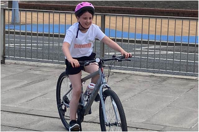Gracie Young arriving at South Shields Amphitheatre  as she completed her charity bike ride.