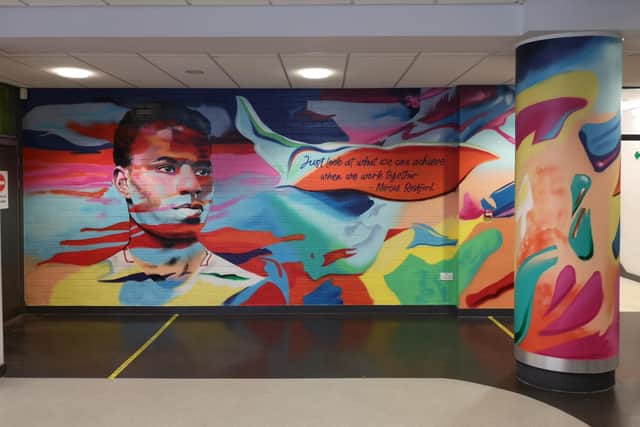 The mural is outside the art department