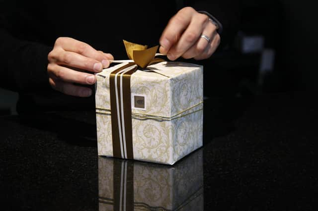 Wrapping presents can be a pain in the back.