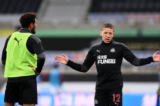 Newcastle United's English striker Dwight Gayle (R) gestures while talking with Newcastle United's Brazilian striker Joelinton (L) ahead of the kickoff during the English Premier League football match between Newcastle United and Aston Villa at St James' Park in Newcastle-upon-Tyne, north east England on March 12, 2021.