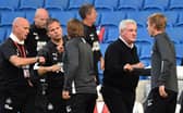 Steve Bruce, Manager of Newcastle United interacts with Graham Potter, Manager of Brighton and Hove Albion at full-time after the Premier League match between Brighton & Hove Albion and Newcastle United at American Express Community Stadium on July 20, 2020 in Brighton, England.
