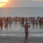 Skinny dippers heading for the sea at dawn.

Photograph: North News and Pictures NNP