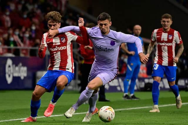 Antoine Griezmann fights for the ball with Barcelona defender Clement Lenglet  (Photo by JAVIER SORIANO/AFP via Getty Images)