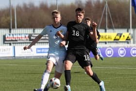 Charlie McArthur of Scotland vies with Dzenan Pejcinovic of Germany during the UEFA Under17 European Championship Qualifier match between Germany U17 and Scotland U17 on March 26, 2022 in Glasgow, Scotland. (Photo by Ian MacNicol/Getty Images)