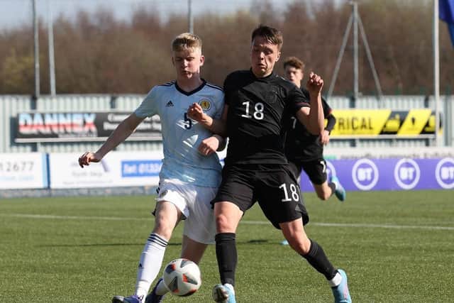 Charlie McArthur of Scotland vies with Dzenan Pejcinovic of Germany during the UEFA Under17 European Championship Qualifier match between Germany U17 and Scotland U17 on March 26, 2022 in Glasgow, Scotland. (Photo by Ian MacNicol/Getty Images)