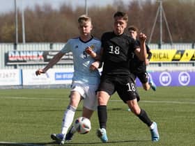 Charlie McArthur of Scotland vies with Dzenan Pejcinovic of Germany during the UEFA Under17 European Championship Qualifier match between Germany U17 and Scotland U17 on March 26, 2022 in Glasgow, Scotland. (Photo by Ian MacNicol/Getty Images)