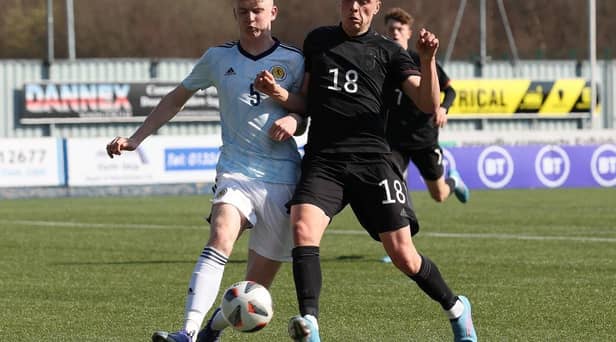 Charlie McArthur of Scotland vies with Dzenan Pejcinovic of Germany during the UEFA Under17 European Championship Qualifier match between Germany U17 and Scotland U17 on March 26, 2022 in Glasgow, Scotland. (Photo by Ian MacNicol/Getty Images)