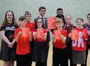 Pupils at St Joseph's take a stand against racism with Cllr Adam Ellison and Show Racism the Red Card education worker Guljar Ahmed