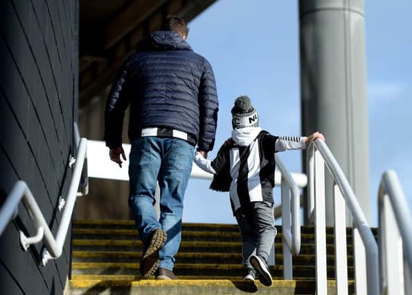 NEWCASTLE UPON TYNE, ENGLAND - FEBRUARY 01: Fans arrive at the stadium prior to the Premier League match between Newcastle United and Norwich City at St. James Park on February 01, 2020 in Newcastle upon Tyne, United Kingdom. (Photo by Mark Runnacles/Getty Images)