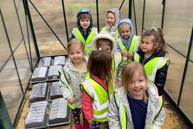 Green-fingered youngsters from Nurserytime got to work at Hebburn Cemetery's new greenhouses.