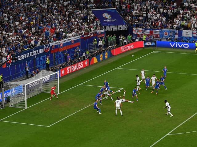 Jude Bellingham of England, scores his team's first goal past Martin Dubravka of Slovakia with an acrobatic kick (Picture: Shaun Botterill/Getty Images)